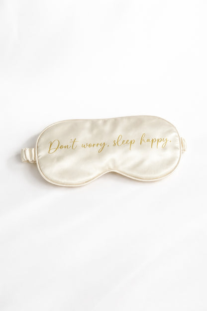 Cremefarbene Schlafmaske mit Aufdruck "Don't worry sleep happy"